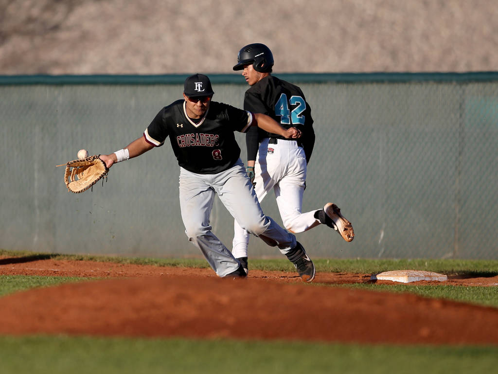 Silverado baserunner Caleb Hubbard (42) crosses first base as Faith Lutheran first baseman J ...