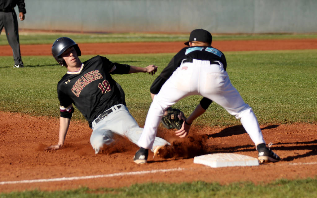 Silverado third baseman Austin Whittaker (25) tags out Faith Lutheran baserunner Michael Car ...