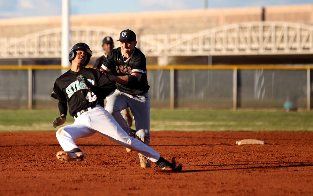 Faith Lutheran second baseman Parker Sylvester (5) tags out Silverado baserunner Caleb Hubba ...