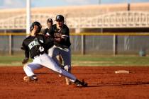 Faith Lutheran shortstop Parker Sylvester (5) tags out Silverado baserunner Caleb Hubbard (4 ...