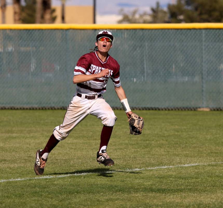 Cimarron-Memorial’s Ethan Daniel (17) looks to catch a foul ball against Silverado in ...
