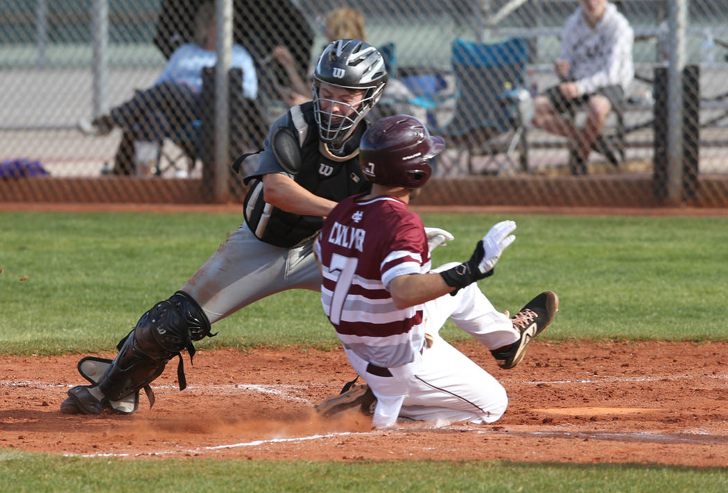 Silverado catcher Brant Hunt (18) tags out Cimarron-Memorial Zach Culver (7) at home in the ...