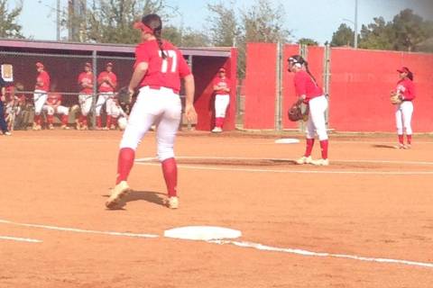 Arbor View’s Kylie Sharapan (center) prepares to deliver a pitch against Coronado in a ...
