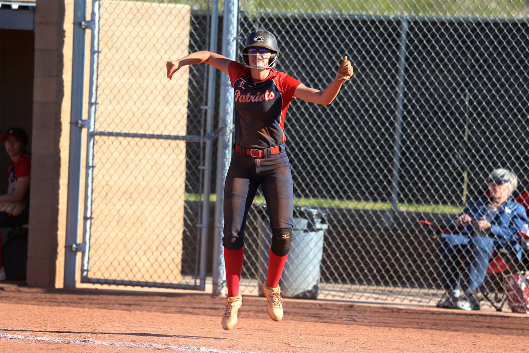 Liberty’s McKenzie LaNeve (42) celebrates a run by her team in the sixth inning agains ...