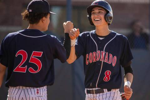 Coronado’s Thomas Planellas (25) congratulates teammate Jett Kenyon (8) after scoring ...