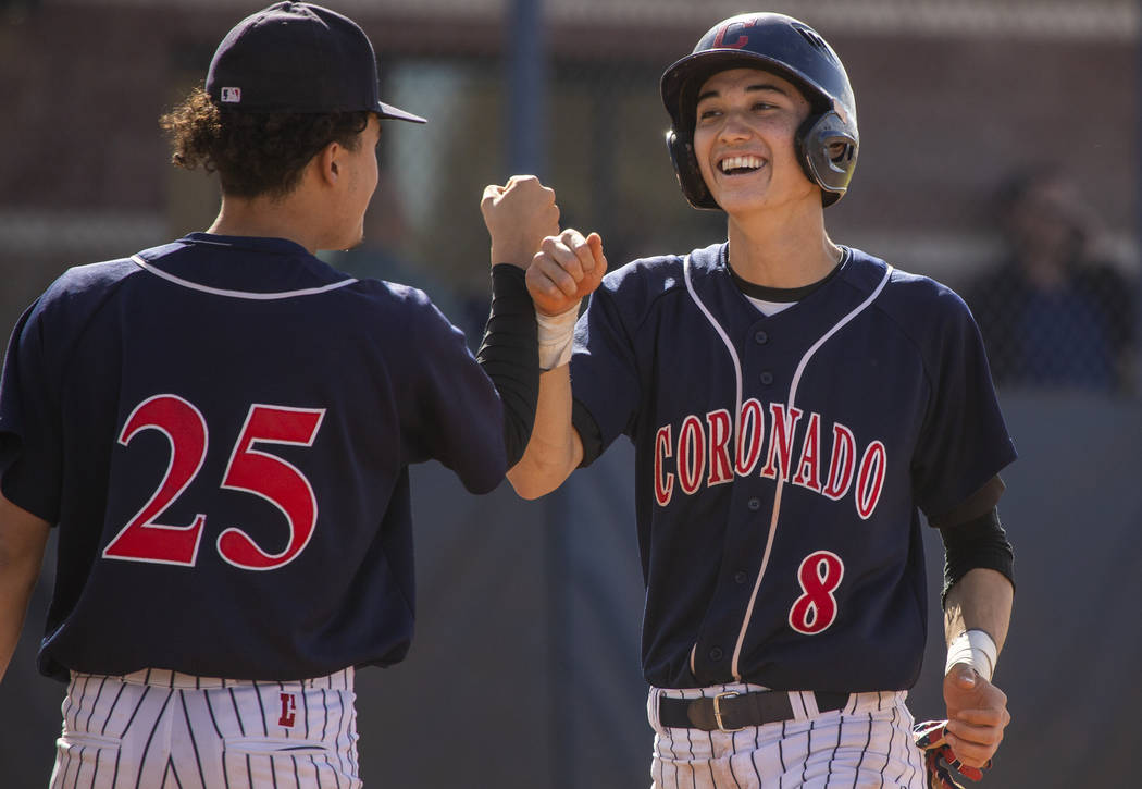Coronado’s Thomas Planellas (25) congratulates teammate Jett Kenyon (8) after scoring ...