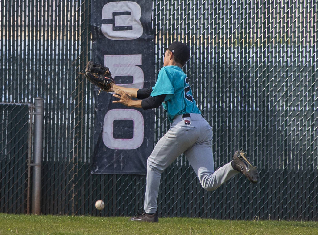 Silverado outfielder Ryeant Horacek (28) is unable to catch a long fly ball from a Coronado ...