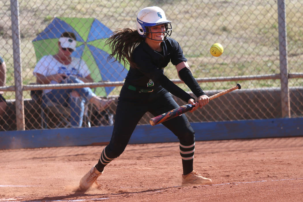 Green Valley’s Olivia McClain (2) bunts the ball for a fly ball and an out against Foo ...