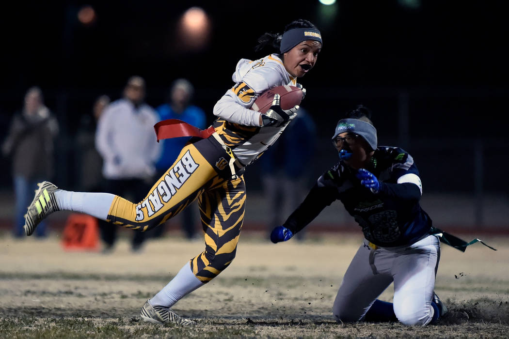 Bonanza’s Ashley Vasquez (75) avoids a tackle from Green Valley’s Anna Marie Arc ...