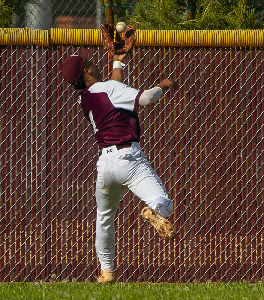 Faith Lutheran’s Dylan Schafer (1) goes deep into center field for a catch from a Palo ...