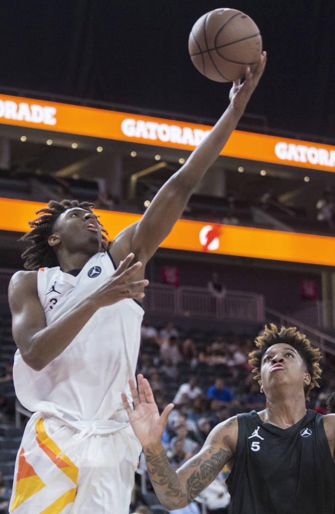 Tyrese Maxey (3) drives baseline past Armando Bacot Jr. (5) in the second half during the Jo ...