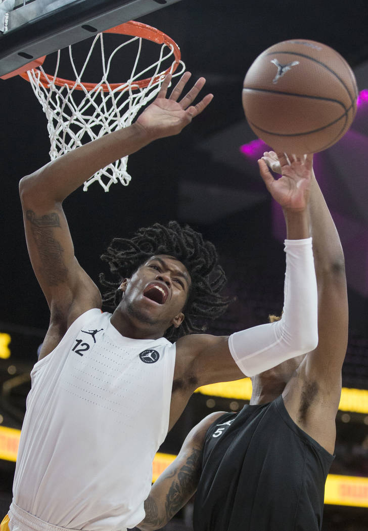 Keion Brooks (12) fights for a loose ball with Armando Bacot Jr. (5) in the second half duri ...