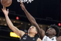 Cole Anthony (50) drives past Isaiah Stewart (33) in the first half during the Jordan Brand ...