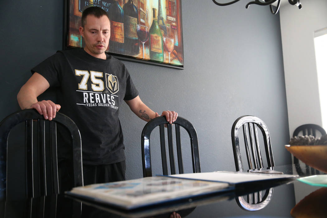 Chris Jachimiec at his home in Las Vegas, looks at a family picture album his mother put togeth ...