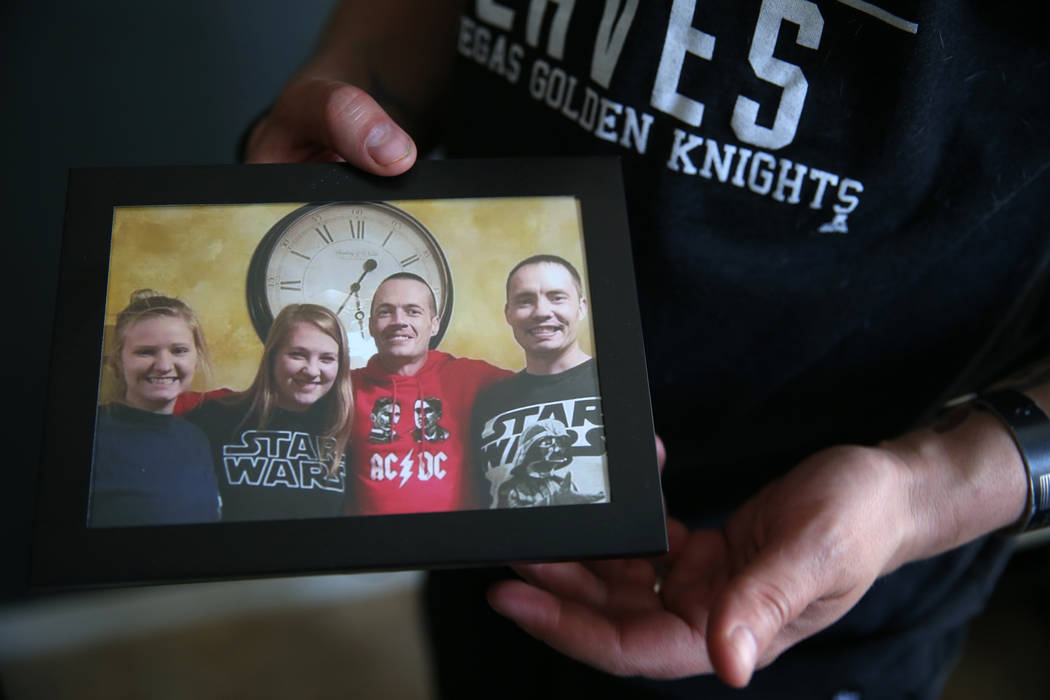 Chris Jachimiec shows a picture with his siblings including Adam Jachimiec, third from left, a ...