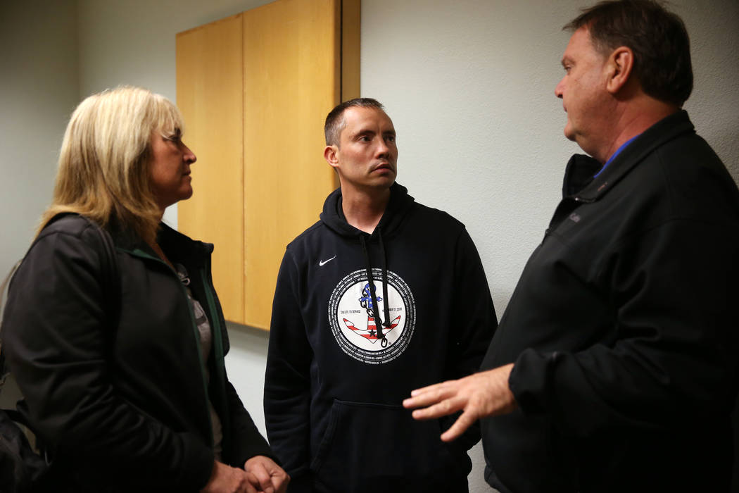 Chuck Reineck, right, with his wife Jeanette, left, speaks to Chris Jachimiec following their s ...