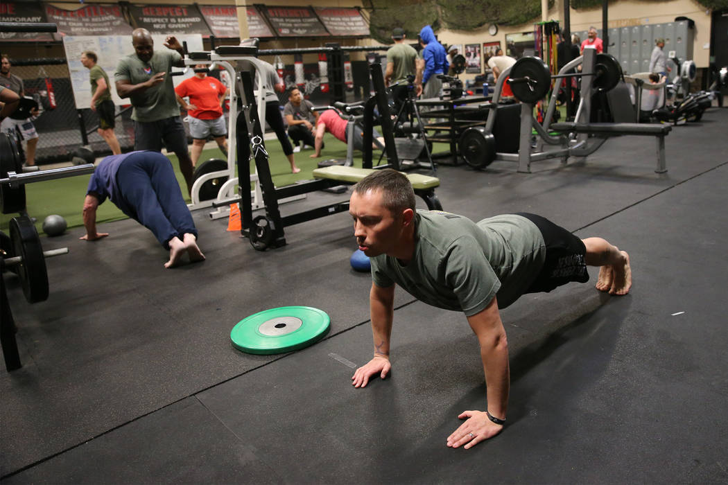 Military veteran Chris Jachimiec works out during a Merging Vets And Players class at Xtreme Co ...