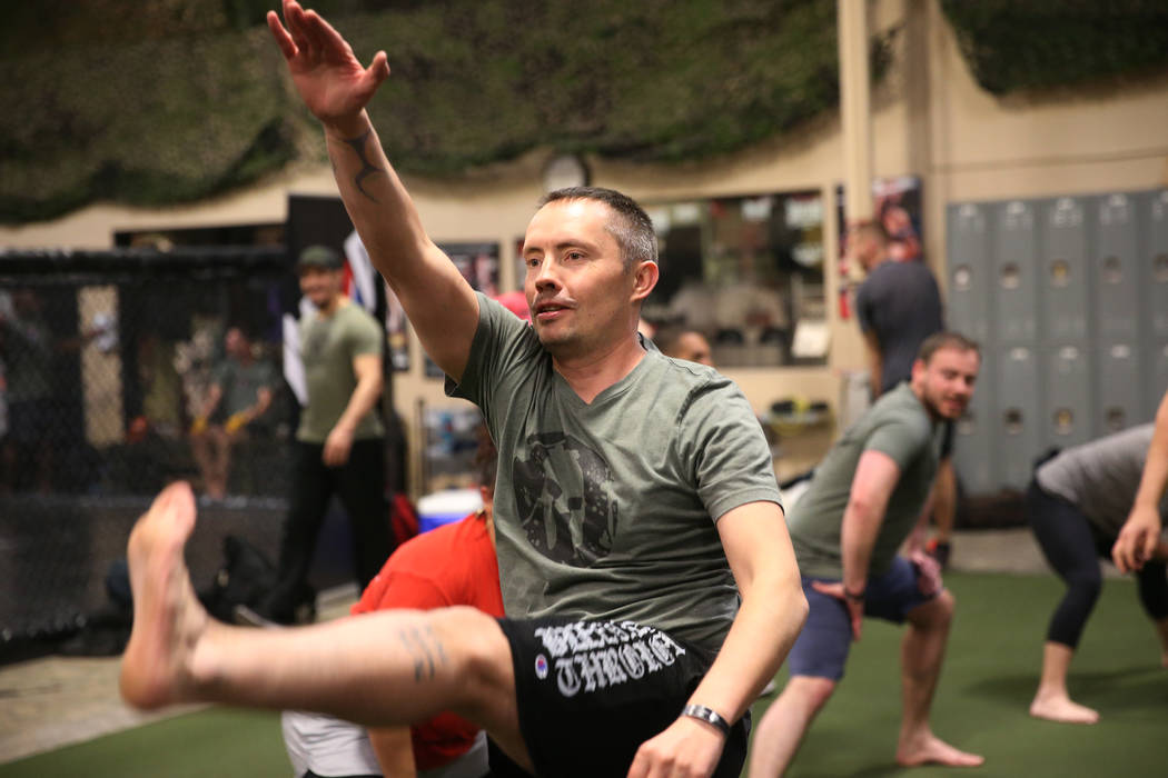 Military veteran Chris Jachimiec works out during a Merging Vets And Players class at Xtreme Co ...