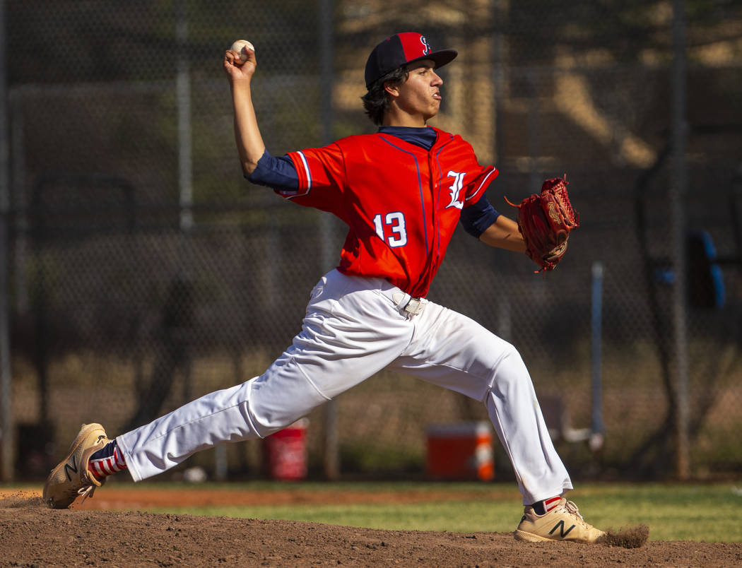 Liberty pitcher Devin Contreras (13) sends another throw towards the plate versus Spring Val ...
