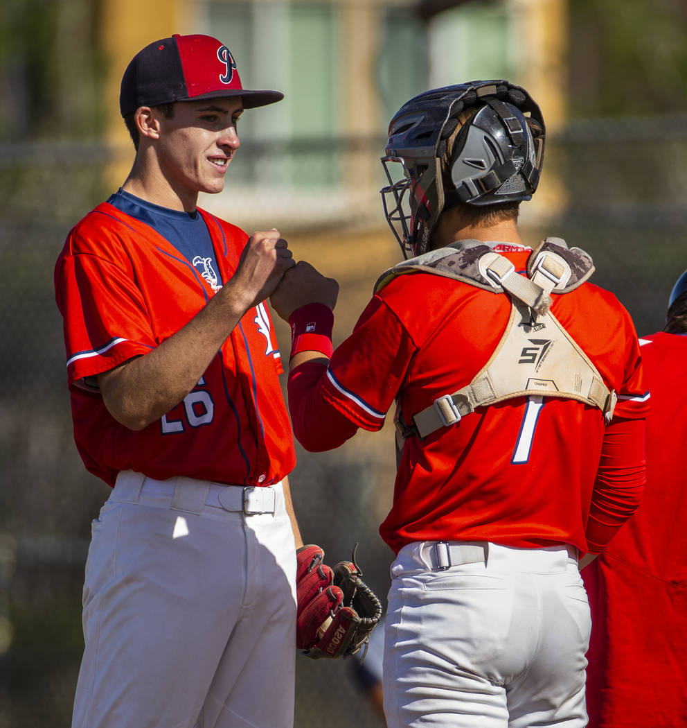 Liberty pitcher Ethan O’Neal (26) is encouraged by catcher Chase Gallegos versus Sprin ...