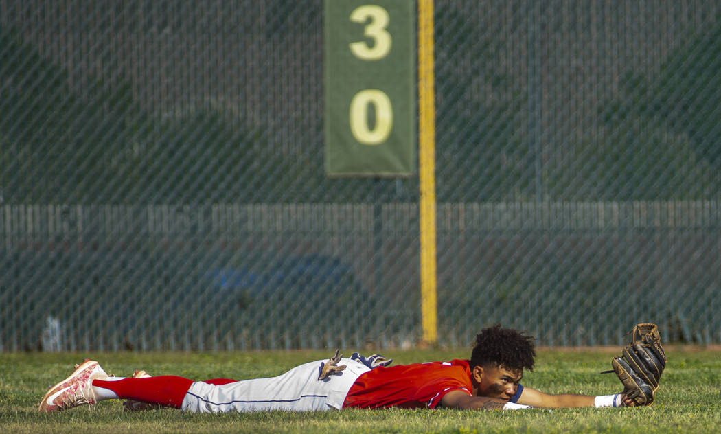 Liberty’s Mason Bowden (1) makes a diving catch in right field over Spring Valley duri ...