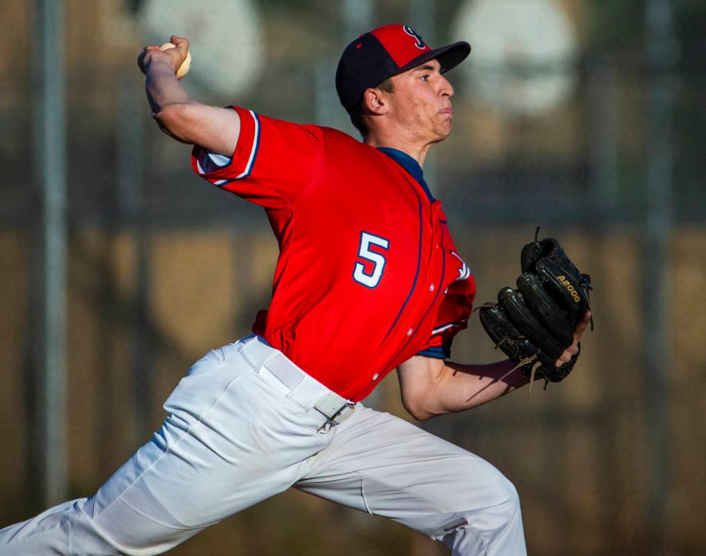 Liberty’ pitcher Garrett Maloney (5) finishes off Spring Valley during the first round ...