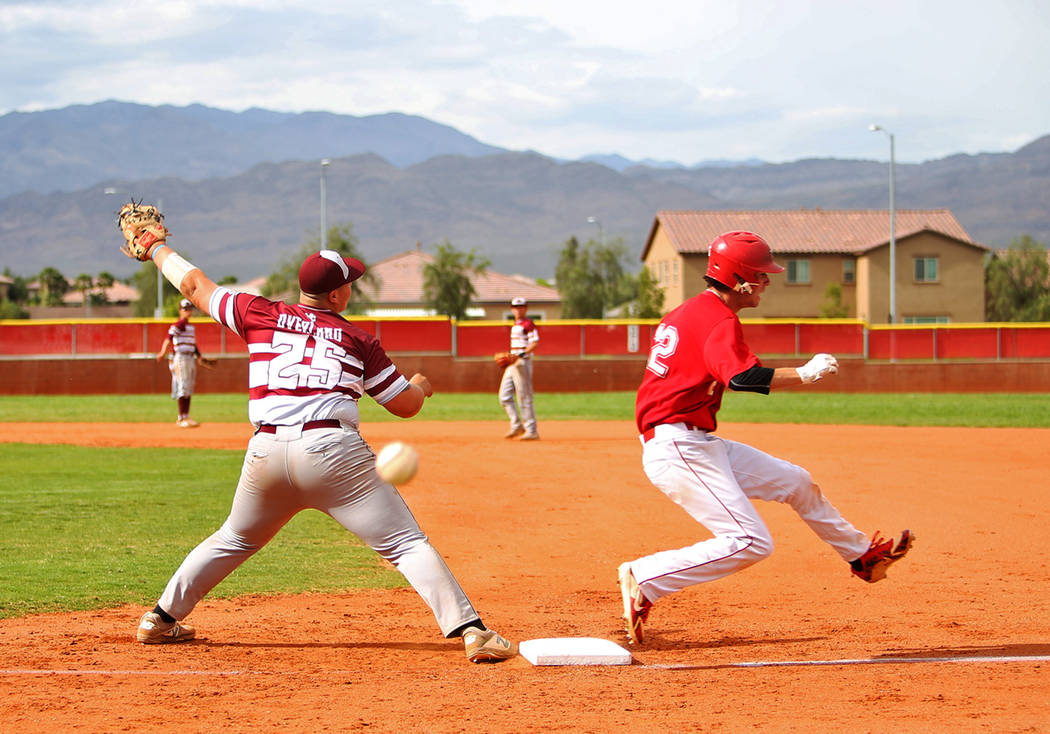 Arbor View’s (12) makes it safe to first as Cimarron-Memorial’s Mike Overland (2 ...