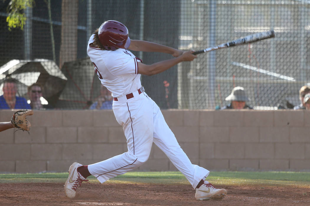 Desert Oasis’ Campbell Holt (16) his a two run homer against Basic in the Desert Regio ...