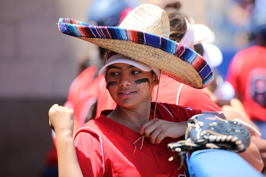 Coronado’s Valeria Bermudez (14) stands in the dugout wearing a sombrero during the So ...