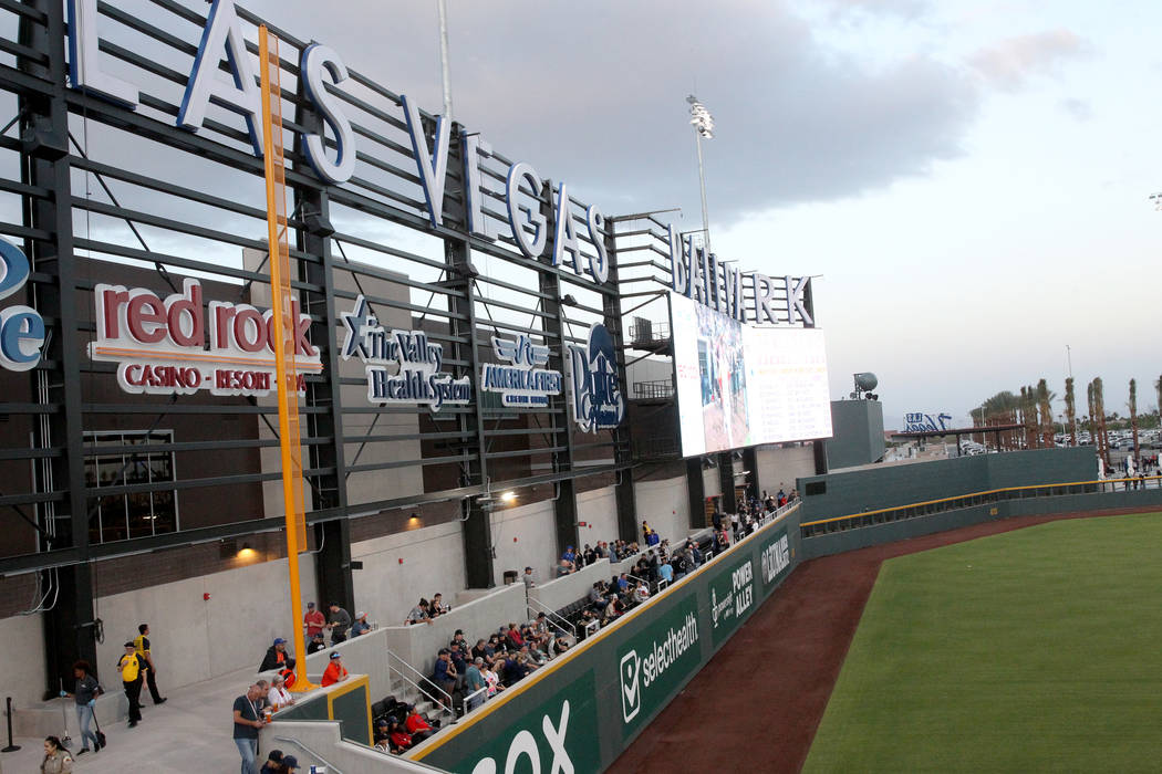Fans watch the action from the left field wall on the first-ever opening night for the Las V ...