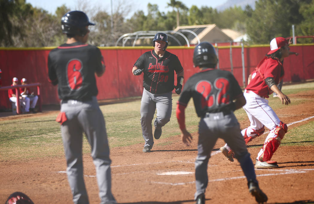 Las Vegas’ first baseman Trevor Johnson (20) scores a run during a baseball game at Ar ...