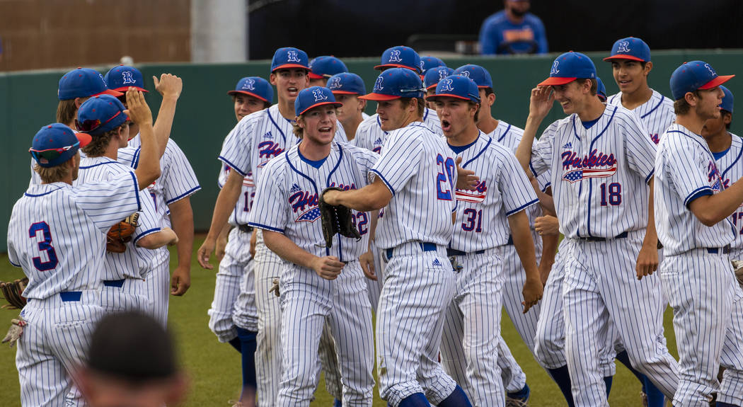 Reno players celebrate another run and a dominating score versus Las Vegas during their stat ...