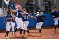 Shadow Ridge players celebrate a home run by Caitlin Covington, not pictured, during the sec ...