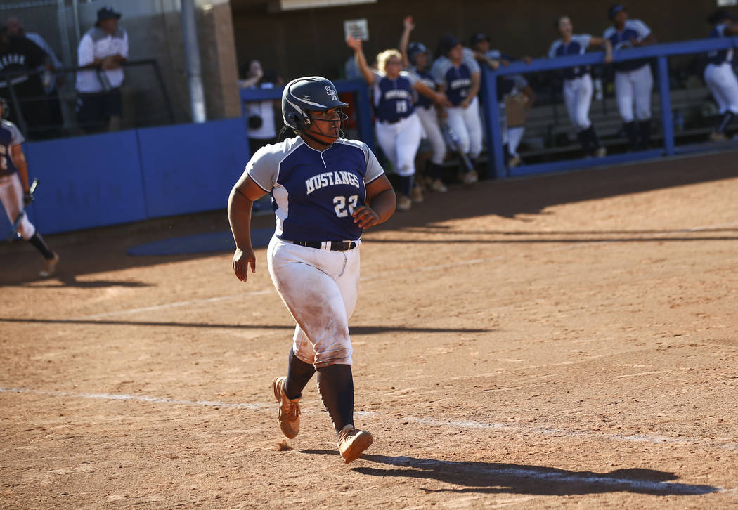 Shadow Ridge’s Alyssa Stanley (22) rounds the bases on her home run hit against McQuee ...