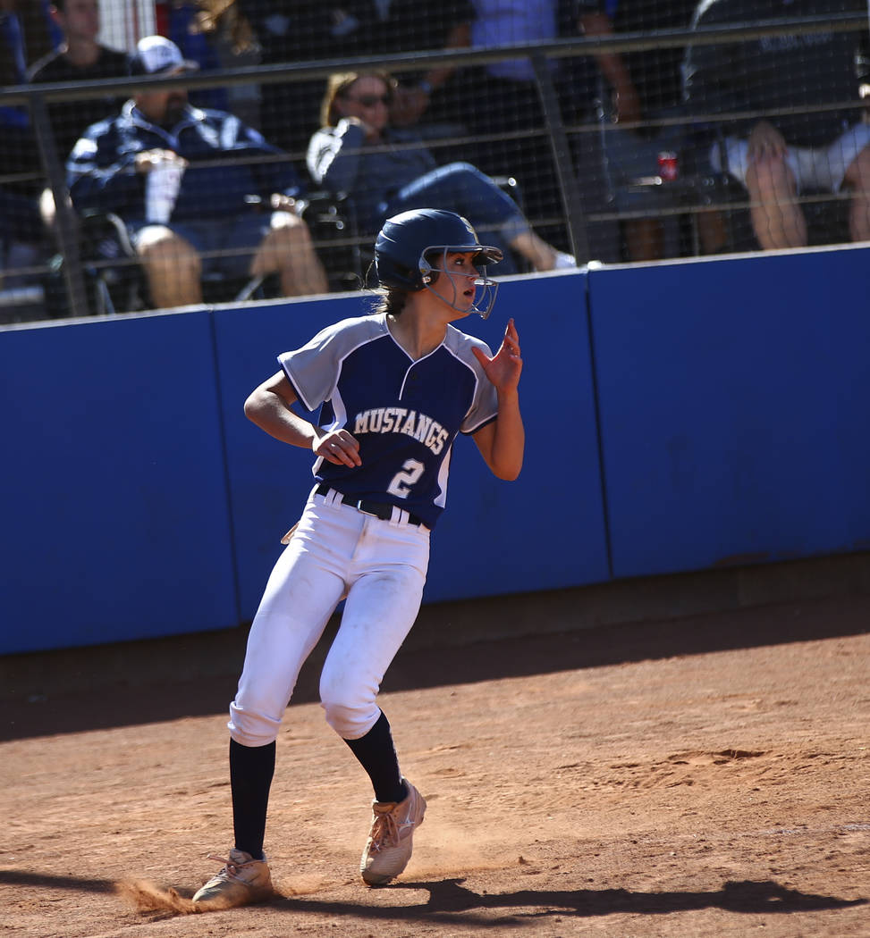 Shadow Ridge’s Jasmine Payne (2) scores a run against McQueen during the second round ...