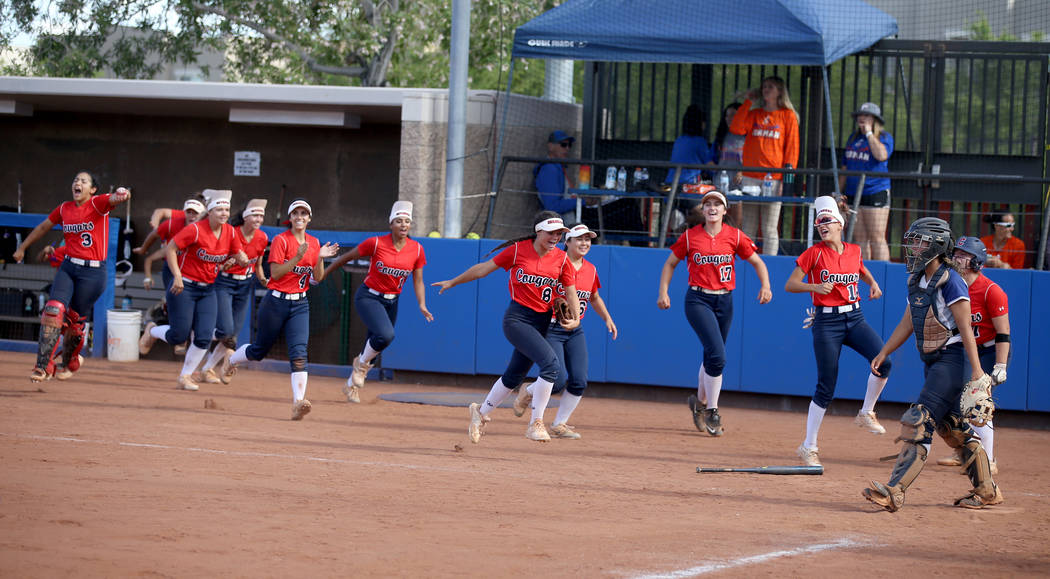 Coronado players celebrate a two-run home run by Kaila Angel (9) against Shadow Ridge in the ...