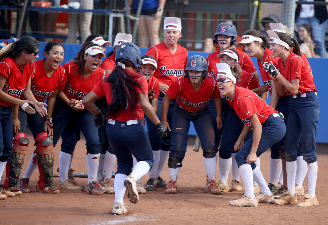 Coronado players celebrate a two-run home run by Kaila Angel (9) against Shadow Ridge in the ...