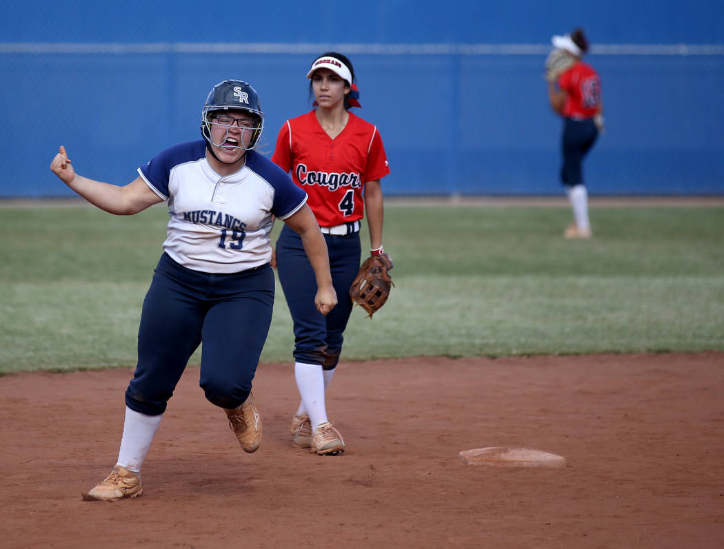 Shadow Ridge Sydney Morgan (19) celebrates her three-run home run against Coronado in their ...