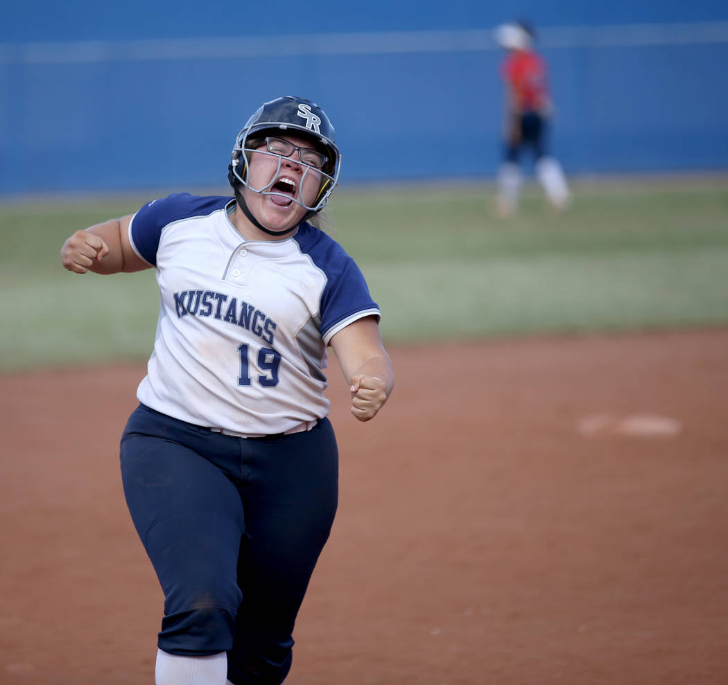 Shadow Ridge Sydney Morgan (19) celebrates her three-run home run against Coronado in their ...