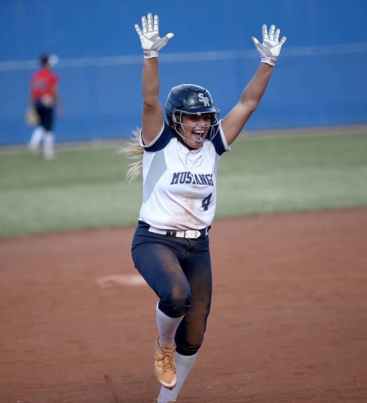 Shadow Ridge’s Shea Clements celebrates her go-ahead home run against Coronado in thei ...