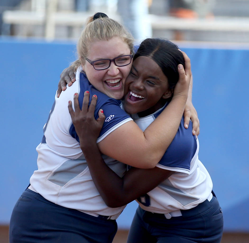 Shadow Ridge’s Sydney Morgan (19), left, and Jasmine Martin (8) celebrate beating Coro ...