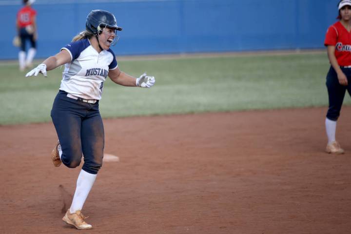 Shadow Ridge’s Shea Clements celebrates her go-ahead home run against Coronado in thei ...