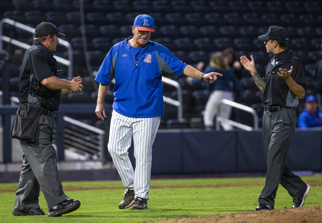 Reno head coach Pete Savage argues a call with the umpires versus Desert Oasis in the third ...