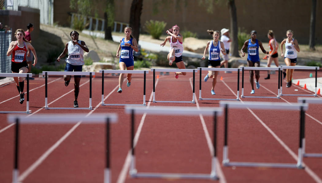 Quincy Bonds Centennial, center, on her way to winning Class 4A 300 meter hurdles in the sta ...