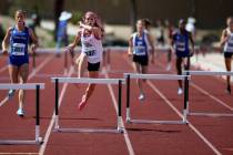 Quincy Bonds of Centennial, second from left, on her way to winning Class 4A 300 meter hurdl ...