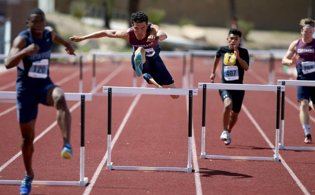 Justin Watterson of Coronado, second from left, on his way to winning Class 4A 300 meter hur ...