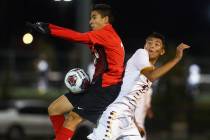 Coronado’s Diaz Alfredo (13) traps the ball while under pressure from Eldorado’s ...