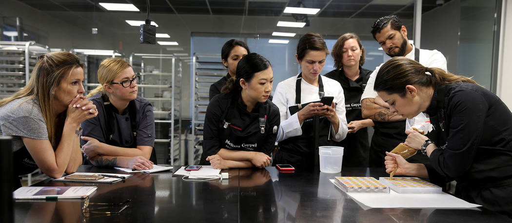 Melissa Coppel, right, teaches chocolate making at her Las Vegas chocolate school Thursday, May ...