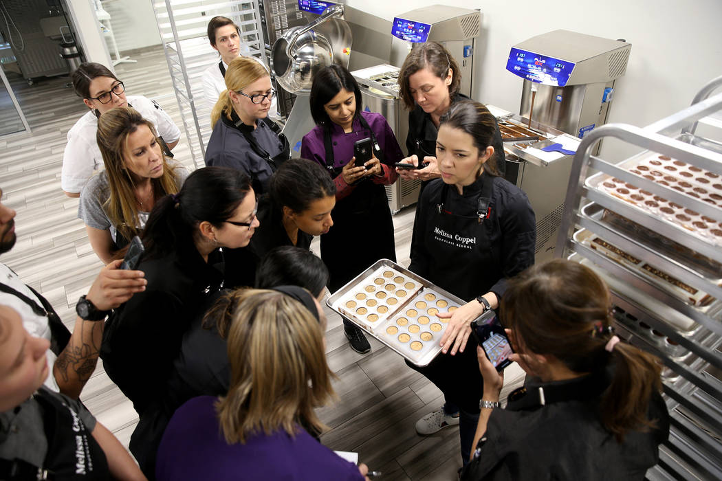 Melissa Coppel, right, teaches chocolate making at her Las Vegas chocolate school Thursday, May ...