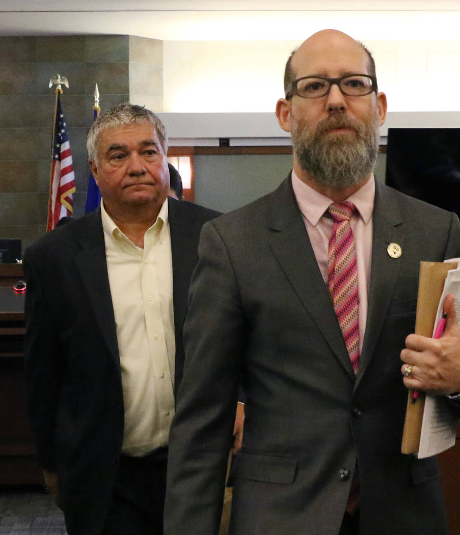 Former Henderson Constable Earl Mitchell, left, leaves the courtroom with his attorney David Fi ...